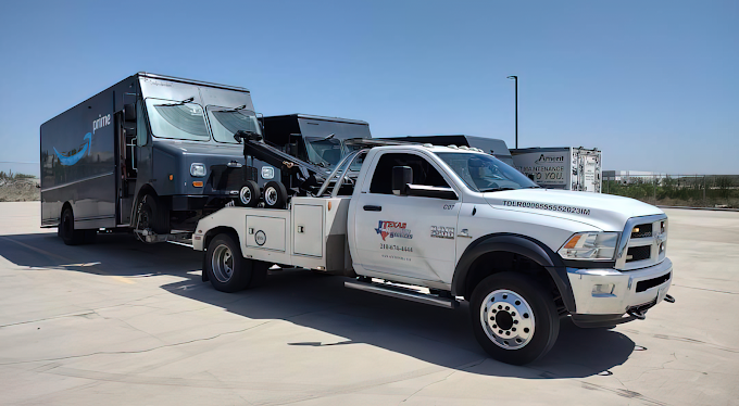 Delivery van recovered by a heavy-duty wrecker